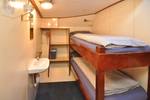 Kabine mit Etagenbett und Waschbecken auf der Chateauroux
