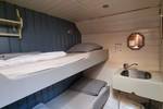 Kabine mit Etagenbett und Waschbecken auf der Medusa