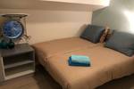 Kabine der Wilhelmina mit Doppelbett und runden Bullaugen